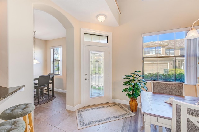 entrance foyer with light tile patterned floors