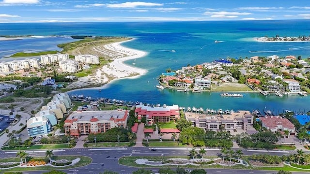 drone / aerial view with a water view and a beach view