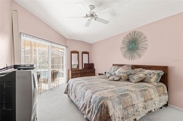 carpeted bedroom featuring ceiling fan, lofted ceiling, and access to exterior