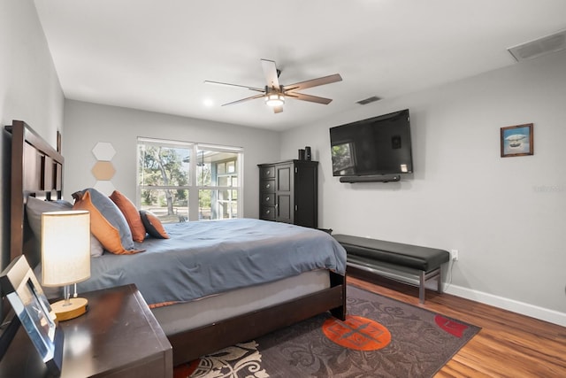 bedroom featuring wood-type flooring and ceiling fan