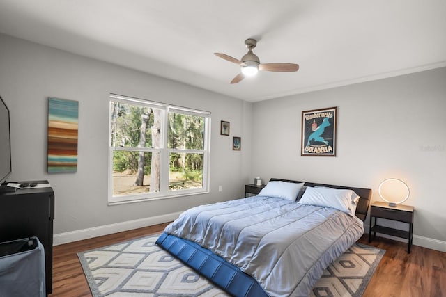 bedroom featuring dark wood-type flooring and ceiling fan