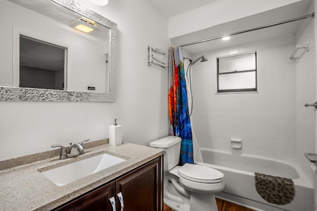 full bathroom with vanity, shower / bathtub combination with curtain, and toilet