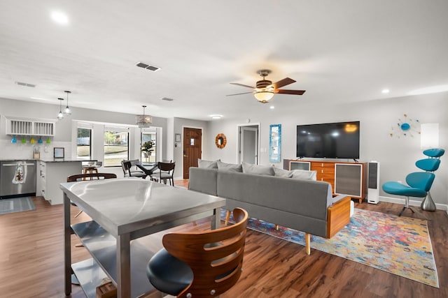 living room with ceiling fan and hardwood / wood-style floors