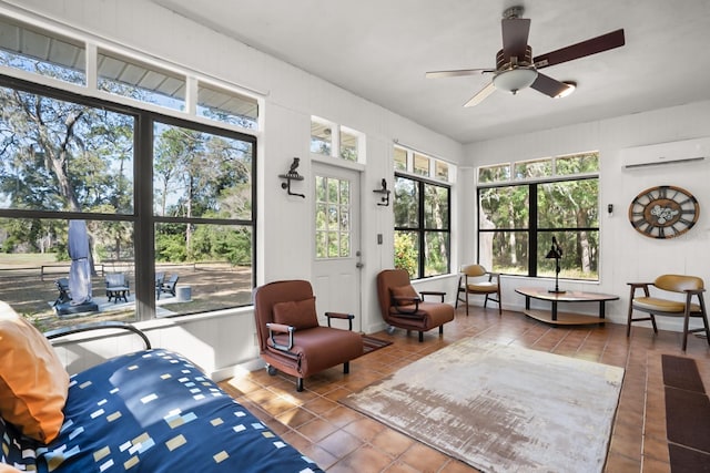 sunroom with a wall mounted air conditioner and ceiling fan