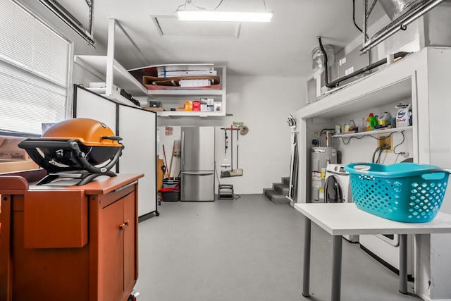 interior space featuring water heater and stainless steel refrigerator