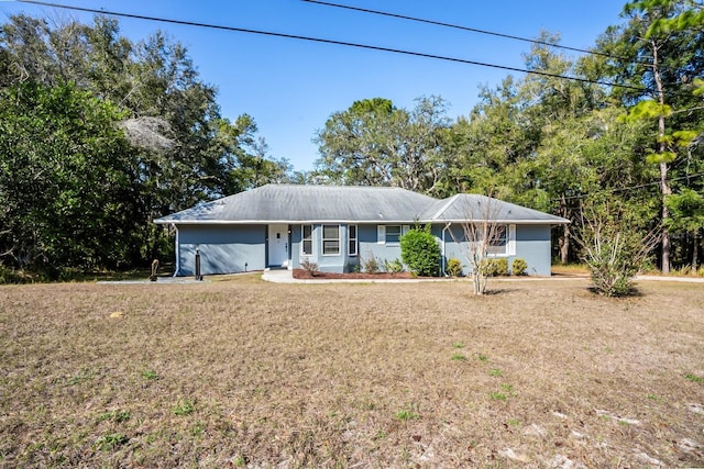 ranch-style house with a front yard