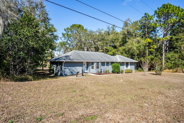 ranch-style home featuring a front yard