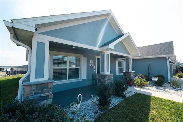 view of front of house featuring a front yard and covered porch