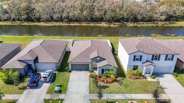 birds eye view of property featuring a water view