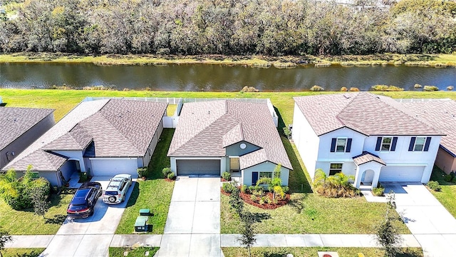 birds eye view of property with a water view