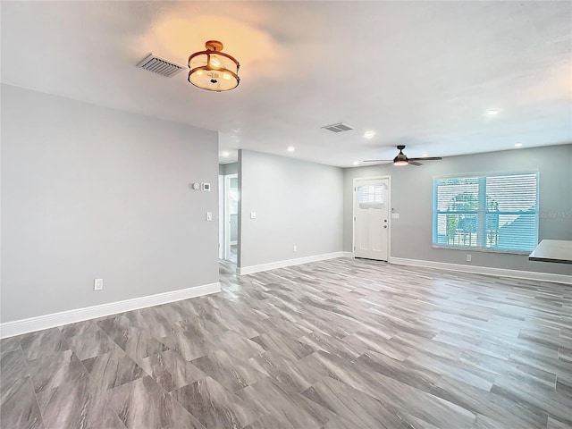 interior space featuring ceiling fan and light hardwood / wood-style flooring