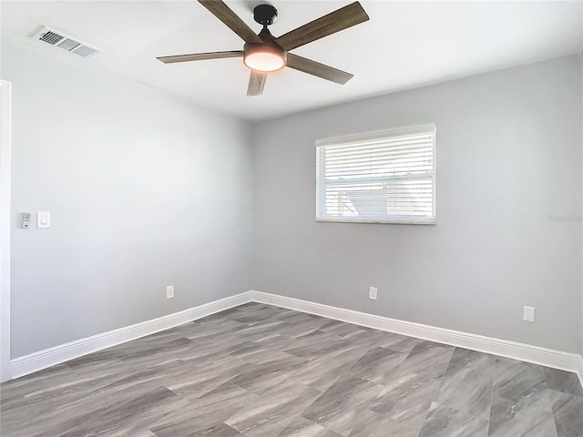 spare room with ceiling fan