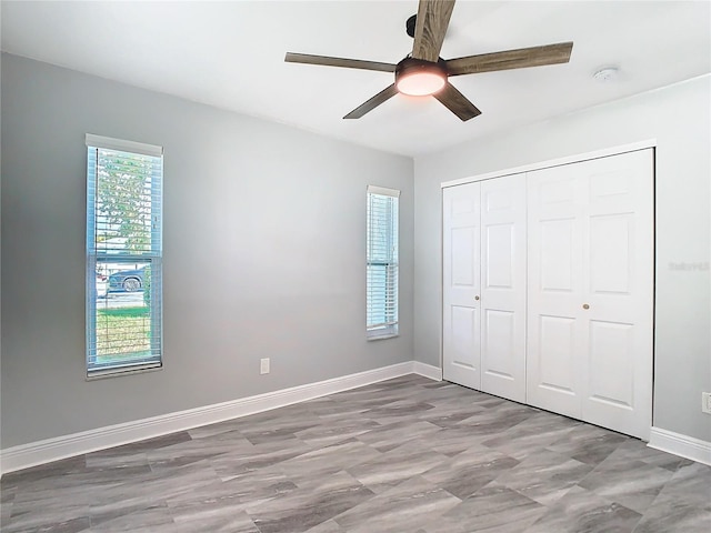 unfurnished bedroom featuring a closet and ceiling fan