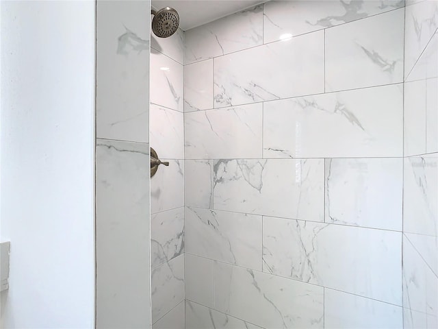 details featuring a tile shower