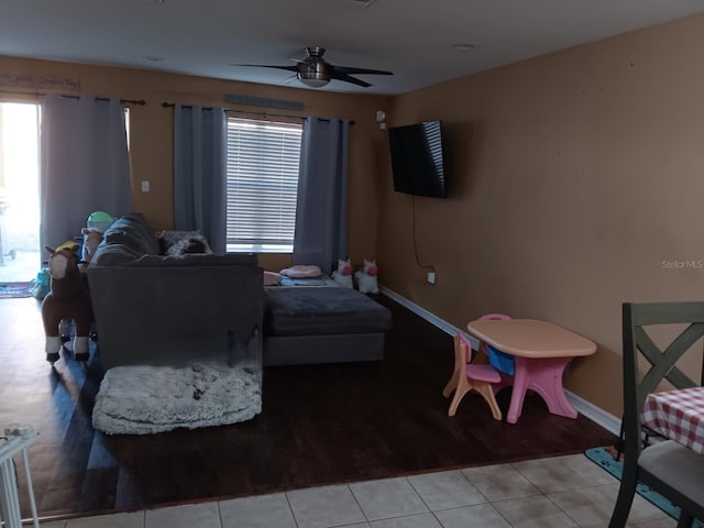 bedroom featuring light tile patterned flooring and ceiling fan