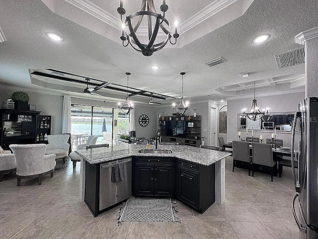 kitchen featuring dishwasher, sink, a kitchen island with sink, light stone counters, and an inviting chandelier