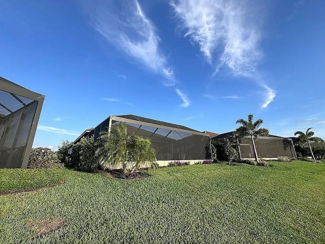 view of yard with a lanai