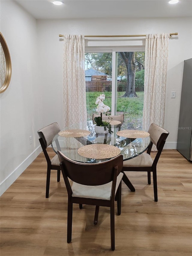 dining room featuring light hardwood / wood-style floors