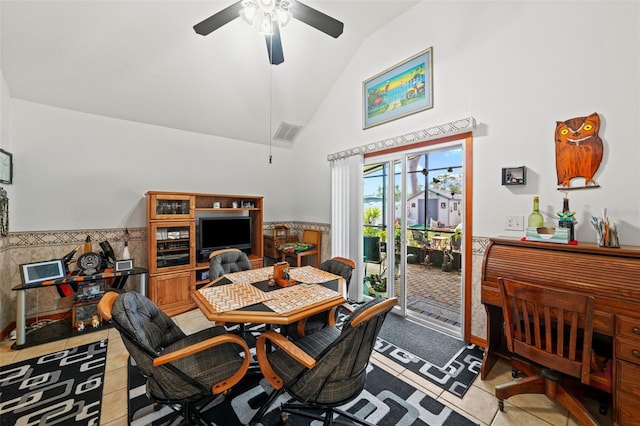 dining space featuring light tile patterned floors, high vaulted ceiling, and ceiling fan