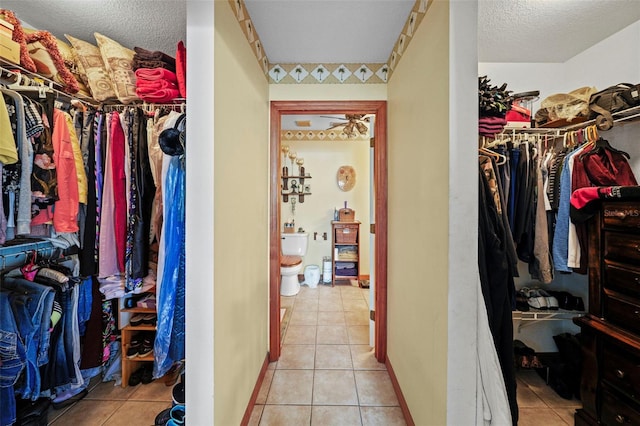 spacious closet featuring light tile patterned floors