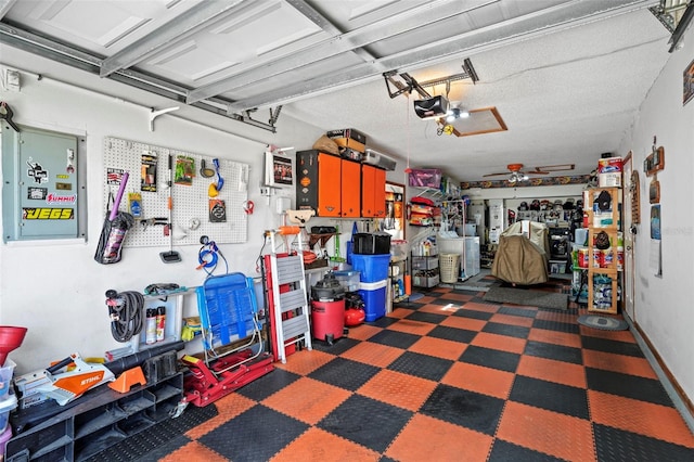 garage with a garage door opener and a workshop area