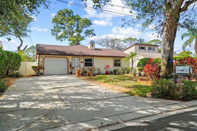 view of front facade with a garage and a front yard