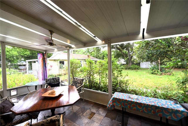 exterior space with ceiling fan