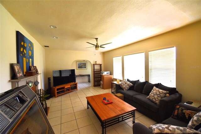 living room featuring light tile patterned flooring and ceiling fan