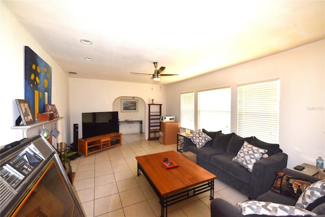 tiled living room featuring ceiling fan