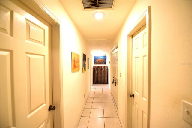 hall with light tile patterned flooring