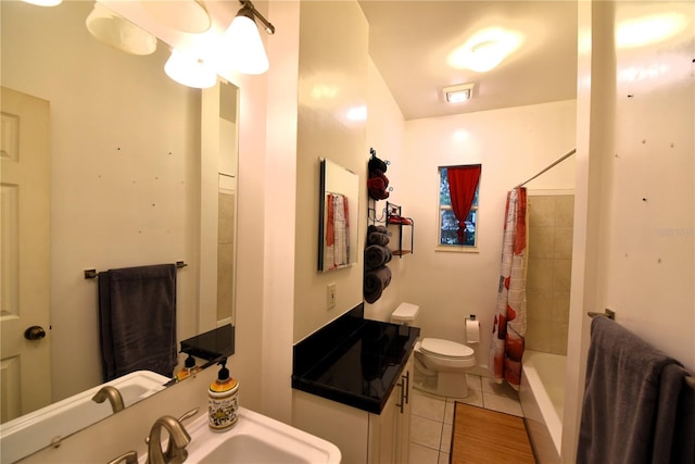 bathroom with tile patterned flooring, sink, and toilet