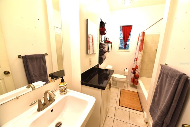 full bathroom with tile patterned floors, toilet, sink, and shower / bath combo with shower curtain