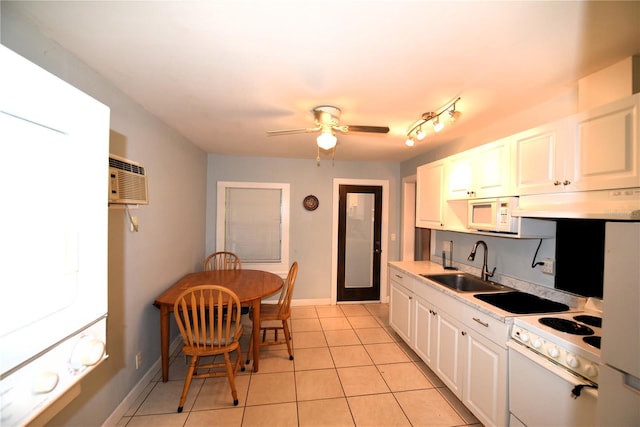 kitchen featuring white cabinetry, sink, light tile patterned flooring, and white appliances