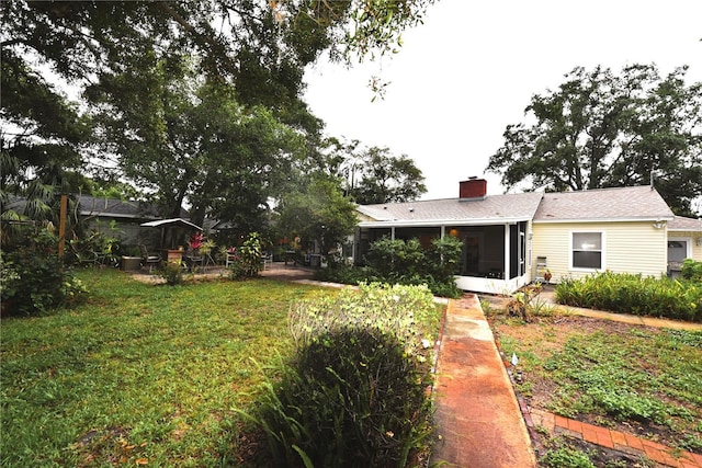 view of yard with a sunroom