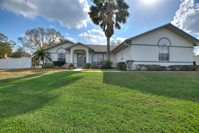 ranch-style house featuring a front yard