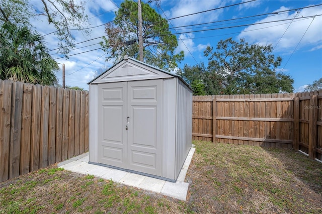 view of outbuilding featuring a lawn