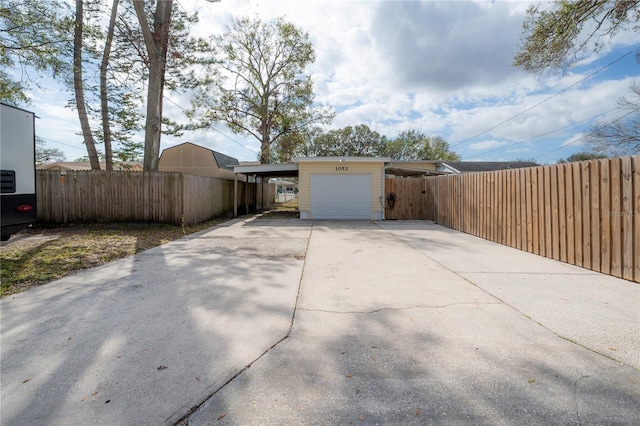 exterior space featuring a carport and a garage