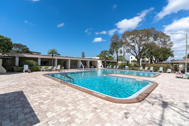 community pool featuring a patio area