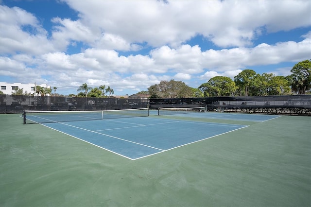 view of sport court with fence