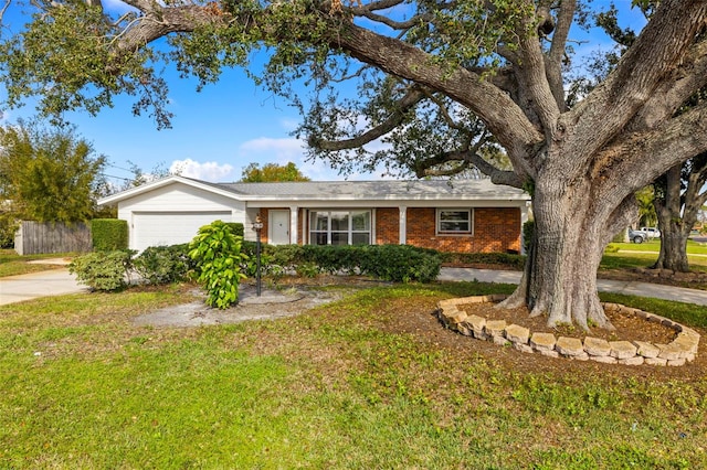 ranch-style house with a garage and a front yard