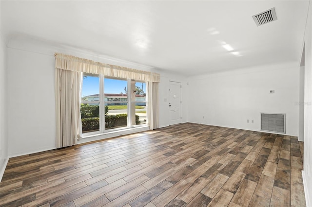 unfurnished living room featuring dark hardwood / wood-style flooring