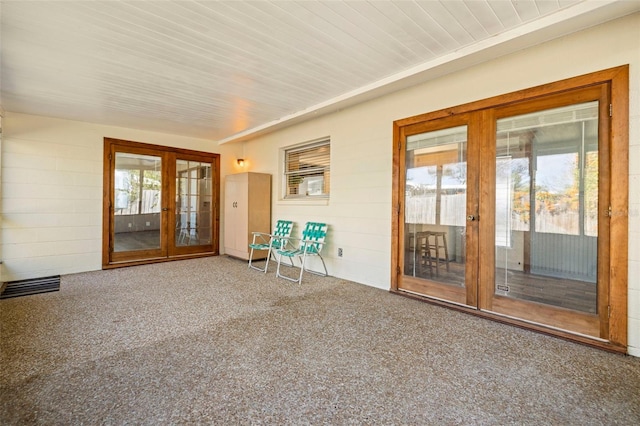 interior space featuring french doors and wooden ceiling