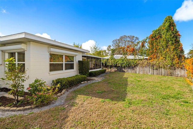 view of yard with a sunroom