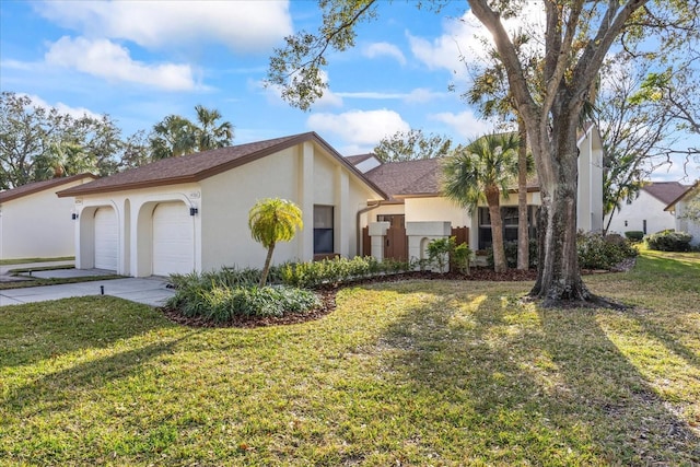 view of front of house with a garage and a front yard