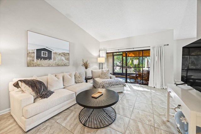 living room with high vaulted ceiling