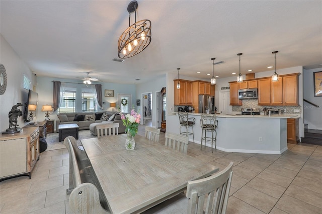 dining area with light tile patterned floors, recessed lighting, and ceiling fan
