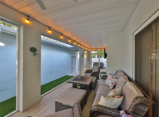 view of patio / terrace featuring an outdoor living space and fence
