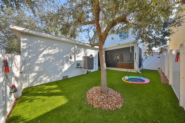 rear view of property with a gate and central AC unit