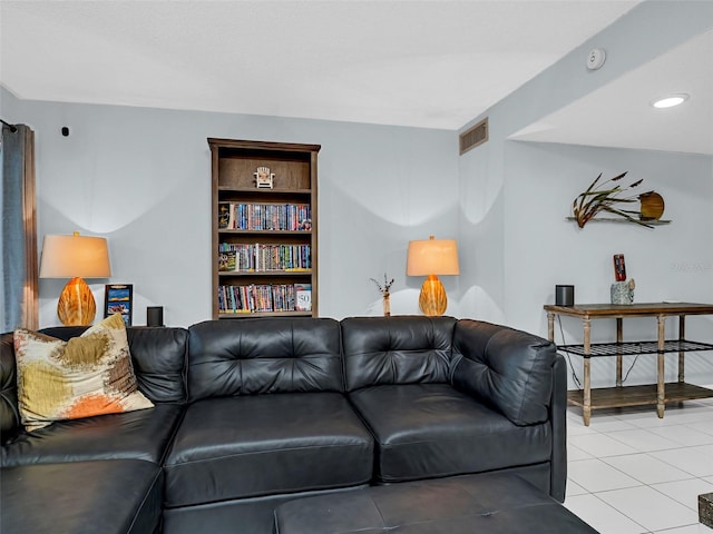 living room with built in features and light tile patterned floors