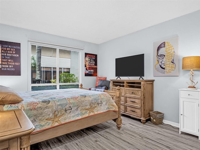 bedroom with hardwood / wood-style flooring